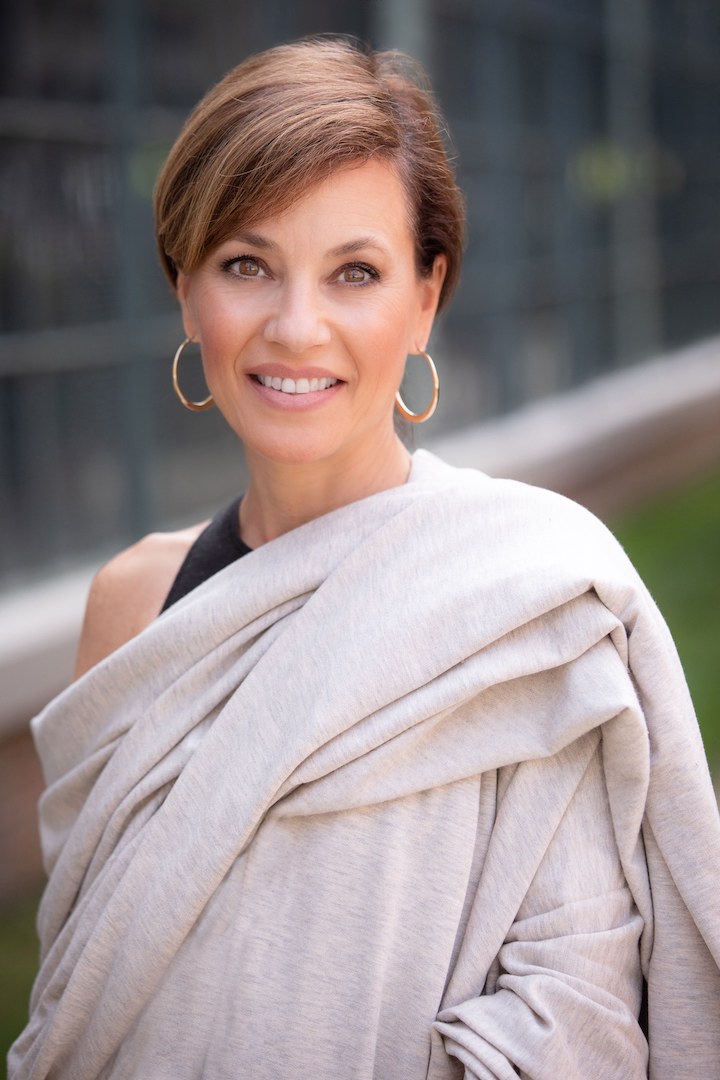Portrait of Angela Gala leading a meditation session