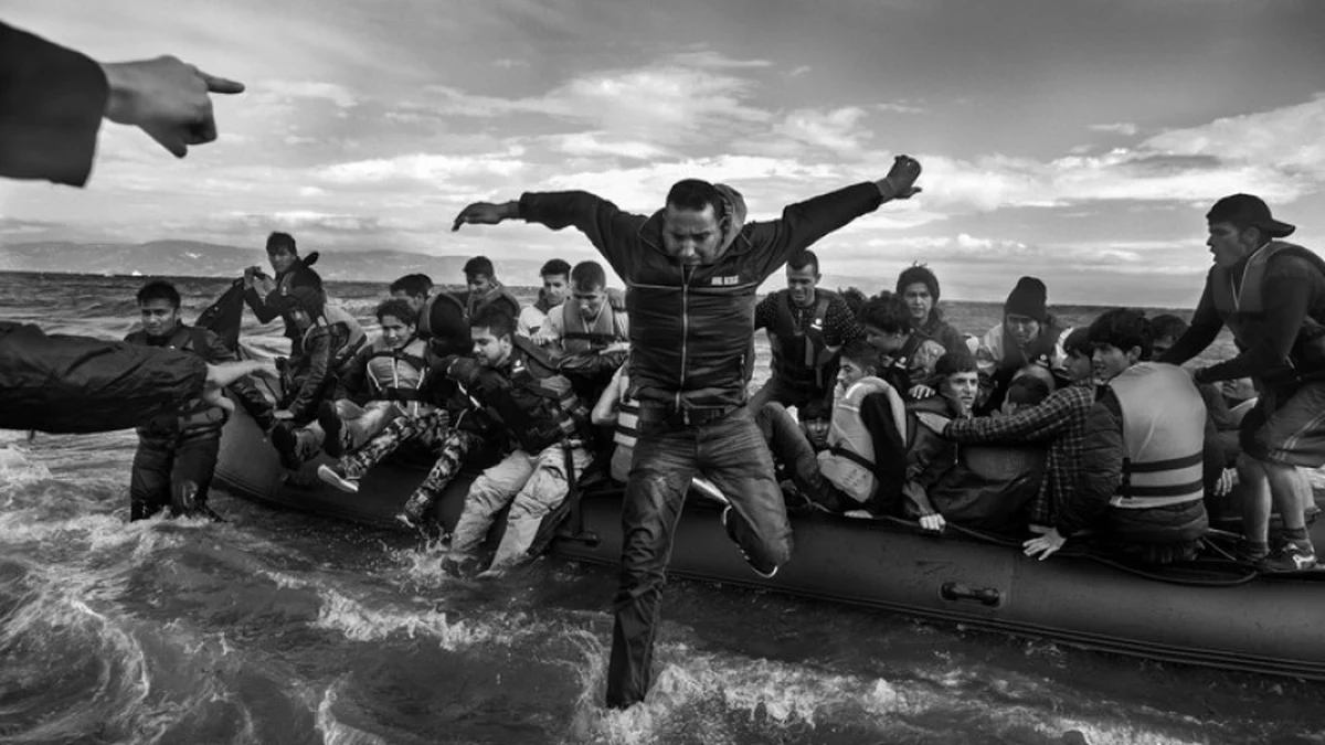 people jumping out of a boat